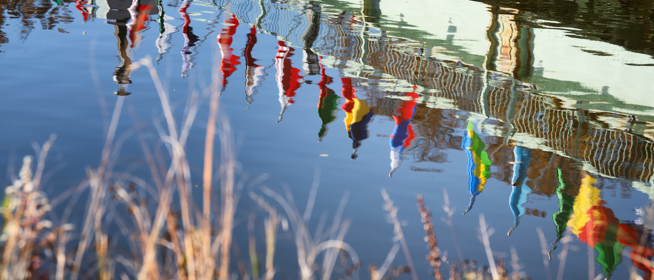 reflections of flags in water