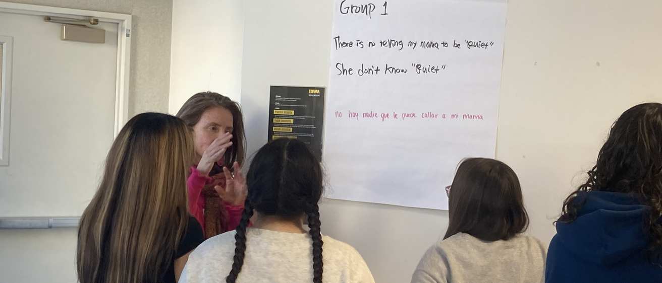 A woman teaching a group of students