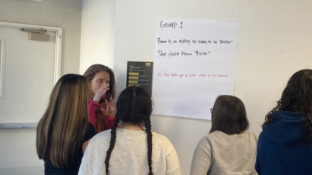A woman teaching a group of students